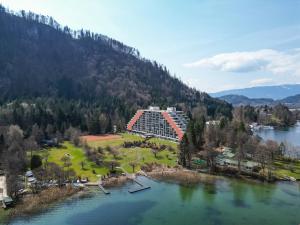 an aerial view of a large building next to a lake at MOOKI Sky by Lake in Villach
