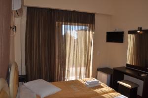 Letto o letti in una camera di Hotel Drosia