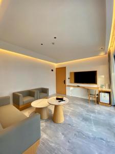 a living room with a couch and a table at Diver's home resort in Panglao Island
