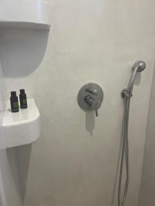 a shower nozzle in a bathroom with a sink at The Dream in Ios Chora