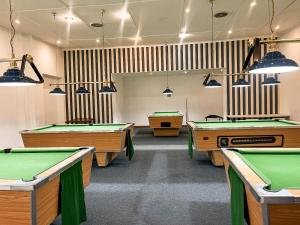a room with billiard tables in a room at St Helena Bay Hotel in St. Helena Bay