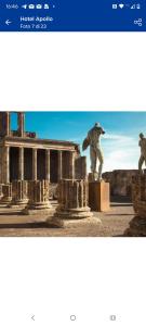a picture of a statue in front of a building at B&B Maestra Giovanna in Pompei +24 photos