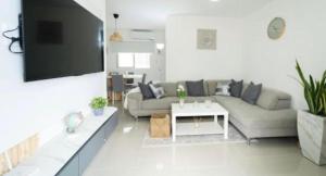 a living room with a couch and a table at Apartament BC in San Cristóbal