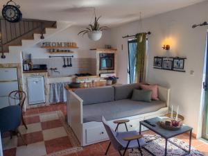 a living room with a couch and a table at Holliday home Alida with jacuzzi in Podgora