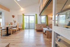 a living room with a couch and a table at Residence Passerhaus in Schenna