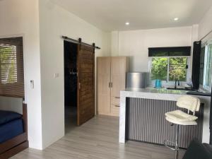 a kitchen with a sink and a counter top at Ocean View Tuggi Klong Prao in Klong Prao Beach