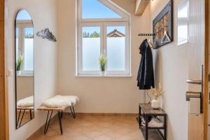 a bathroom with a mirror and a window at Bright Lake View Apartment with Balcony and Air Conditioning in Tutzing +23 photos