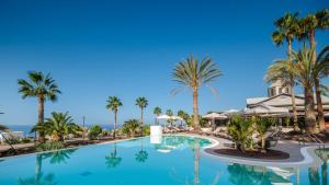 a view of the pool at a resort with palm trees at Bahia Principe Escape Tenerife - Hyatt Inclusive Collection in Adeje