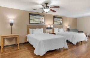 a bedroom with two beds and a ceiling fan at Extended Stay America Suites - St Petersburg - Clearwater - Executive Dr in Clearwater +35 photos