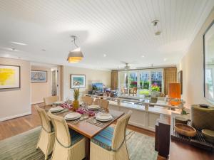 a dining room with a table and chairs at 3-Bed Villa 115 at Turtle Bay in Kahuku