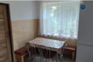 a small room with a table and a window at 9 Dańce - comfortable accommodation 22-220 - WIFI included in Dańce