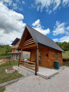 a log cabin with a black roof at A-frame Đukić in Jajce