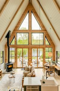 an open living room with a large group of windows at Paddle Point in West Milford