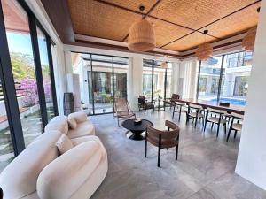 a living room with a white couch and a table at Diver's home resort in Panglao Island