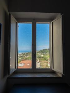 an empty room with a window with a view at Guest House Maramà in Belvedere Marittimo