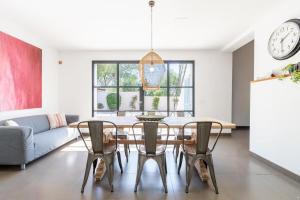a dining room with a table and chairs at Villa Palma - Establiments by PriorityVillas in Palma de Mallorca +15 photos