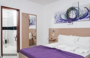 Ένα ή περισσότερα κρεβάτια σε δωμάτιο στο Hotel Cesaria