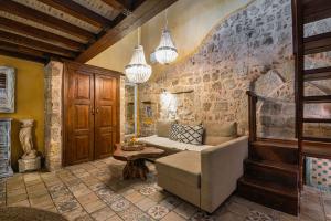 a living room with a couch and a table at George & Alexandra's Apartments in Rhodes Town +87 photos