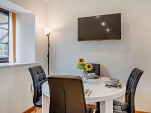 a dining room with a white table and chairs at 2 Bed in Bristol oc-72837 in Chew Magna