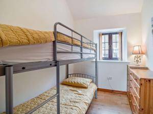a bedroom with two bunk beds and a desk at 2 Bed in Bristol oc-72837 in Chew Magna
