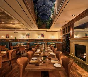a long dining room with a long table and chairs at Walker Hotel Greenwich Village in New York