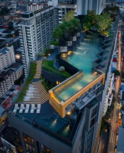 an overhead view of a building with a swimming pool at EDGE Sea View Holiday inn Pattaya Central in Pattaya