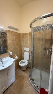 a bathroom with a toilet and a sink and a shower at Asterisco Casa Vacanze in Turin
