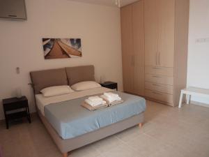 Кровать или кровати в номере Lefka's Villas