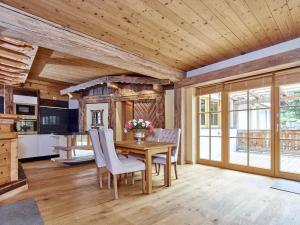 a kitchen and dining room with a table and chairs at Emmat Apartments in Leutasch