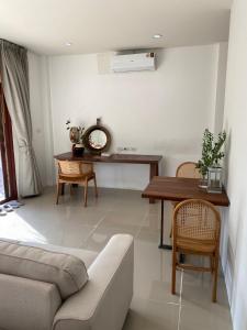 a living room with a couch and a table at Arunta Samui in Lipa Noi +58 photos