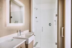 a bathroom with a sink and a shower at SpringHill Suites by Marriott Chesterfield in Chesterfield +17 photos