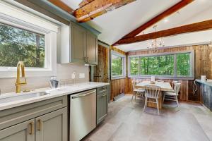 a kitchen with a table and a dining room at Lincoln Gap Retreat in Warren