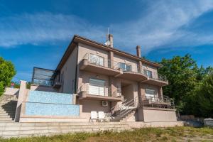 a house with a swimming pool in front of it at Villa Manuela in Opatija