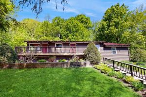 a house with a deck and a yard at Lincoln Gap Retreat in Warren