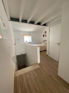 a large room with a bed and a room with a room at Tomarhousing Heritage in Tomar