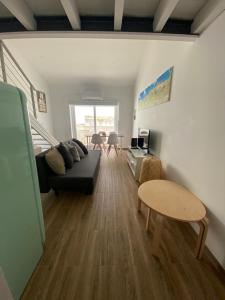 a living room with a couch and a table at Tomarhousing Heritage in Tomar