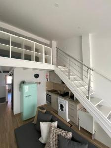 a living room with a staircase in a apartment at Tomarhousing Heritage in Tomar