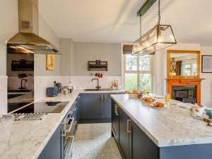 a kitchen with a large counter top and a sink at 1 Bed in York oc-91888 in Full Sutton +12 photos