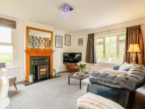 a living room with a couch and a fireplace at 1 Bed in York oc-91888 in Full Sutton