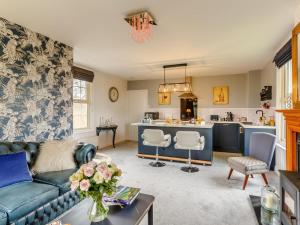 a living room with a couch and a kitchen at 1 Bed in York oc-91888 in Full Sutton