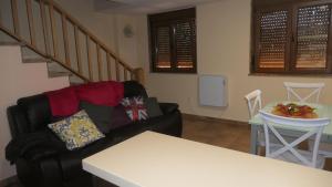 a living room with a couch and a table at Casa Leo in Cee