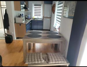 a kitchen with a table in the middle of a room at Holiday home Samir in Jajce