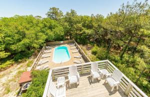 an overhead view of a deck with chairs and a swimming pool at Carotank Clubhouse - Corolla Village, 200 Yds to Beach, Foosball, Pool, Hot Tub, Flex Stays in Corolla