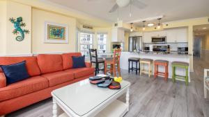 a living room with a couch and a table at Sunrise Penthouse 3316 Ocean Pointe 1BR 2BA in Tavernier +46 photos