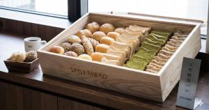 a wooden box filled with different types of pastries at Nesthotel Alt Meguro Ekimae in Tokyo
