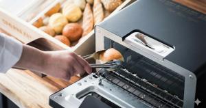 a person is cutting an apple with a machine at Nesthotel Alt Meguro Ekimae in Tokyo