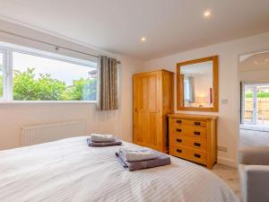 a bedroom with a large bed and a large window at 1 Bed in Wells oc-88969 in Wells