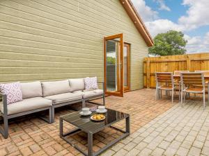 a patio with a couch and a table at 1 Bed in Wells oc-88969 in Wells