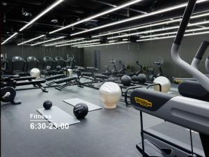a gym with a bunch of weights and machines at Mitsui Garden Hotel Roppongi Tokyo Premier in Tokyo