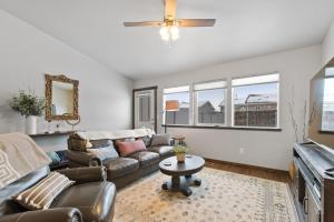 a living room with a couch and a tv at Destiny Cove in Kalispell